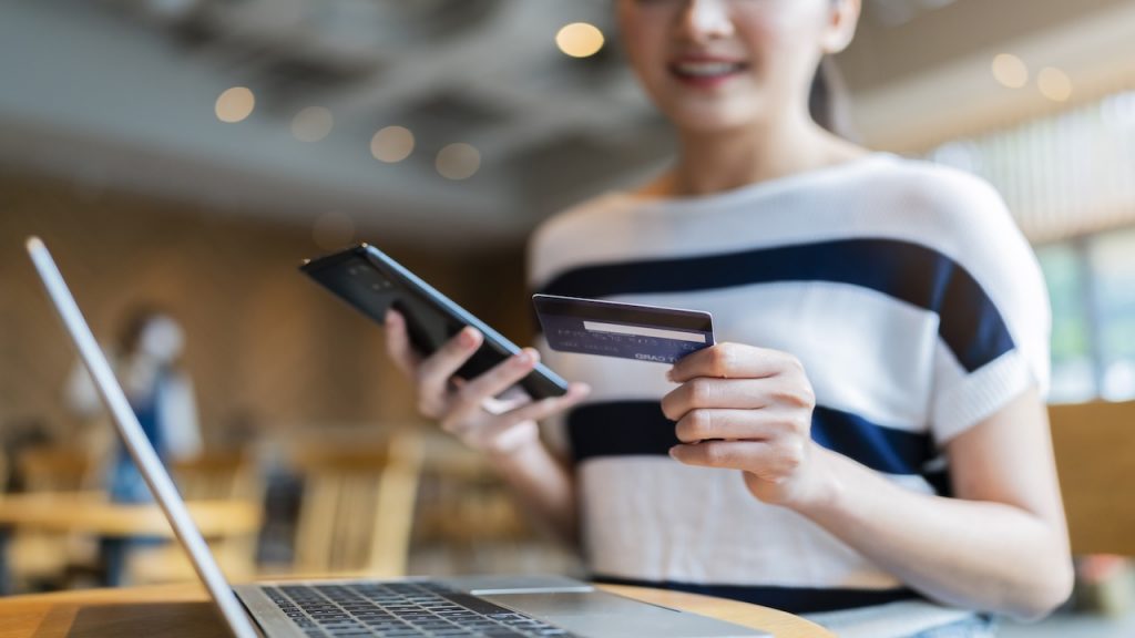 attractive casual smart asian female woman online shopping purchase online with credit card data and laptop technology lifestyle